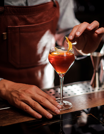 Bartender crafting a cocktail at Roth’s Sea & Steak.